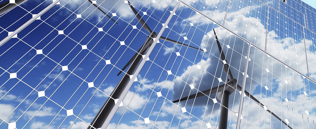 Wind turbines reflected in solar panels